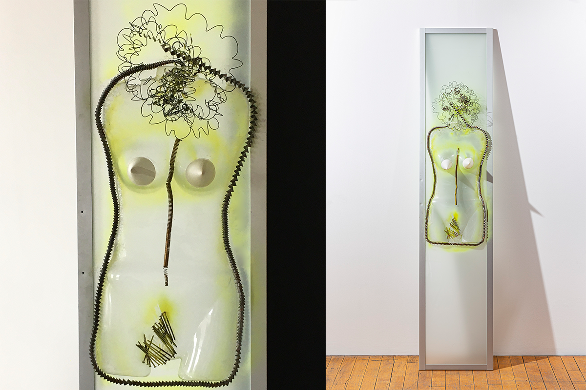 A yellow-green multimedia sculptural work depicting a female torso