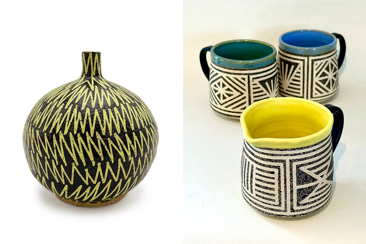 A black vase painted with yellow zigzags juxtaposed with three ceramic mugs painted with geometric lines and shapes