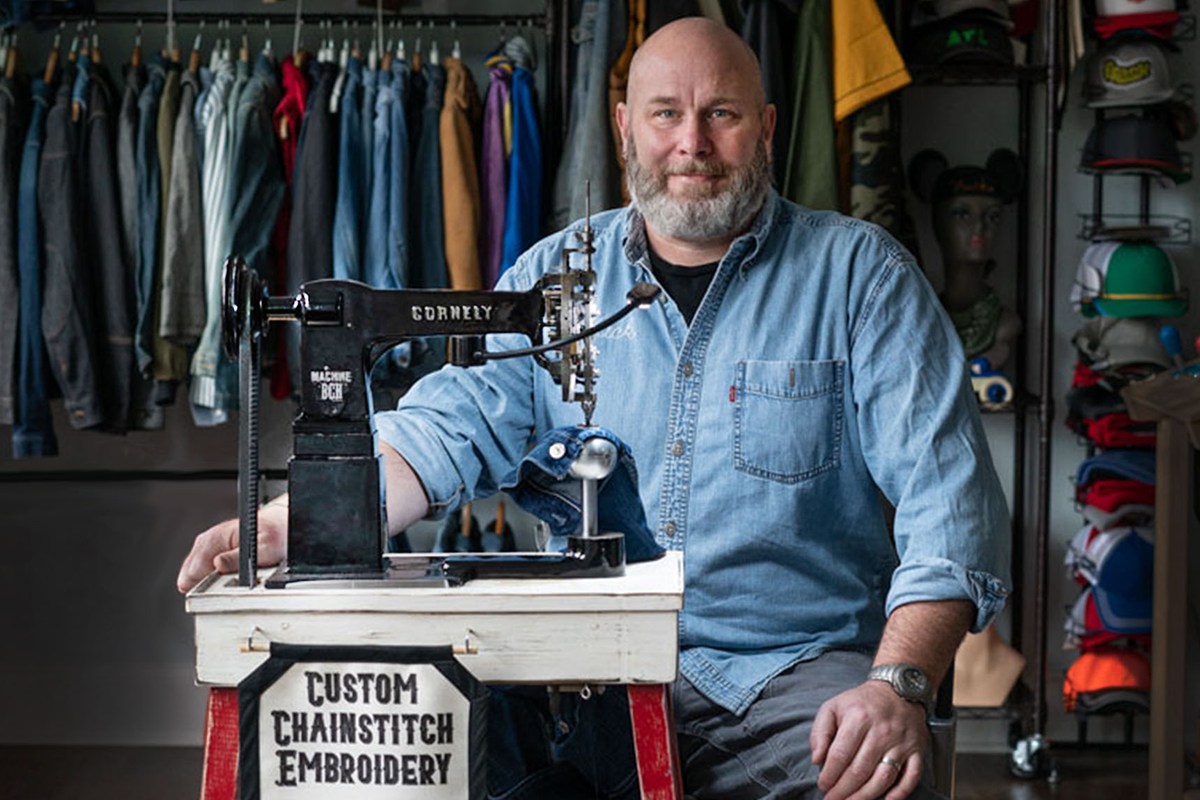 Huckleberry Starnes with one of this 100 year old hand guided embroidery machines