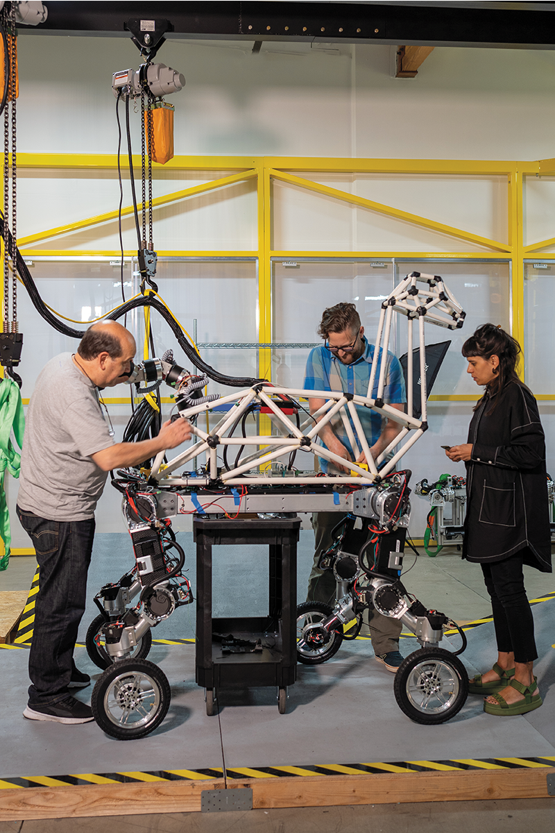 Paula Gaetano Adi (at right) with Miguel Grassii, the lead Argentinian engineer who worked on the robotic tail and vision system and New Horizons engineer Michael Webber.