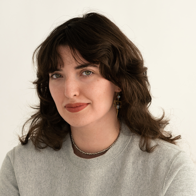 Elizabeth J. Goodspeed is a grey sweater