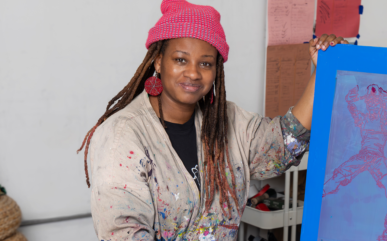 Jazzmen Lee Johnson holds one of her pieces in her studio at Atlantic Mills
