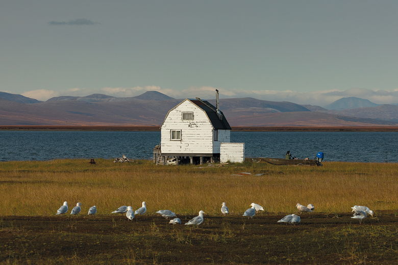 A subsistence camp faces the shore of Safety Sound. The lagoon remains an important subsistence area for residents of Nome and surrounding communities, but is under pressure for commercial development. In 2022, a Nevada-based company’s proposal to dredge Safety Sound for gold was denied by the US Army Corps of Engineers.