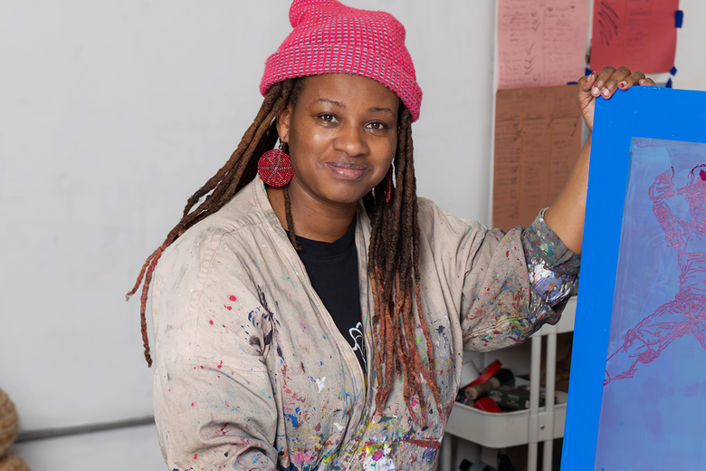 Jazzmen Lee Johnson holds one of her pieces in her studio at Atlantic Mills 